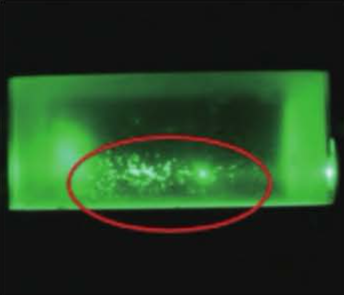 Cloud-like bubbles and light scattering particles in optical sapphire