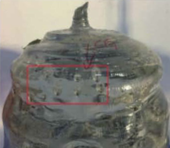 Cloud-like bubbles and light scattering particles in optical sapphire